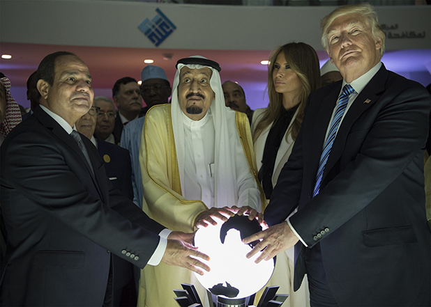 image of world leaders with their hands on a globe