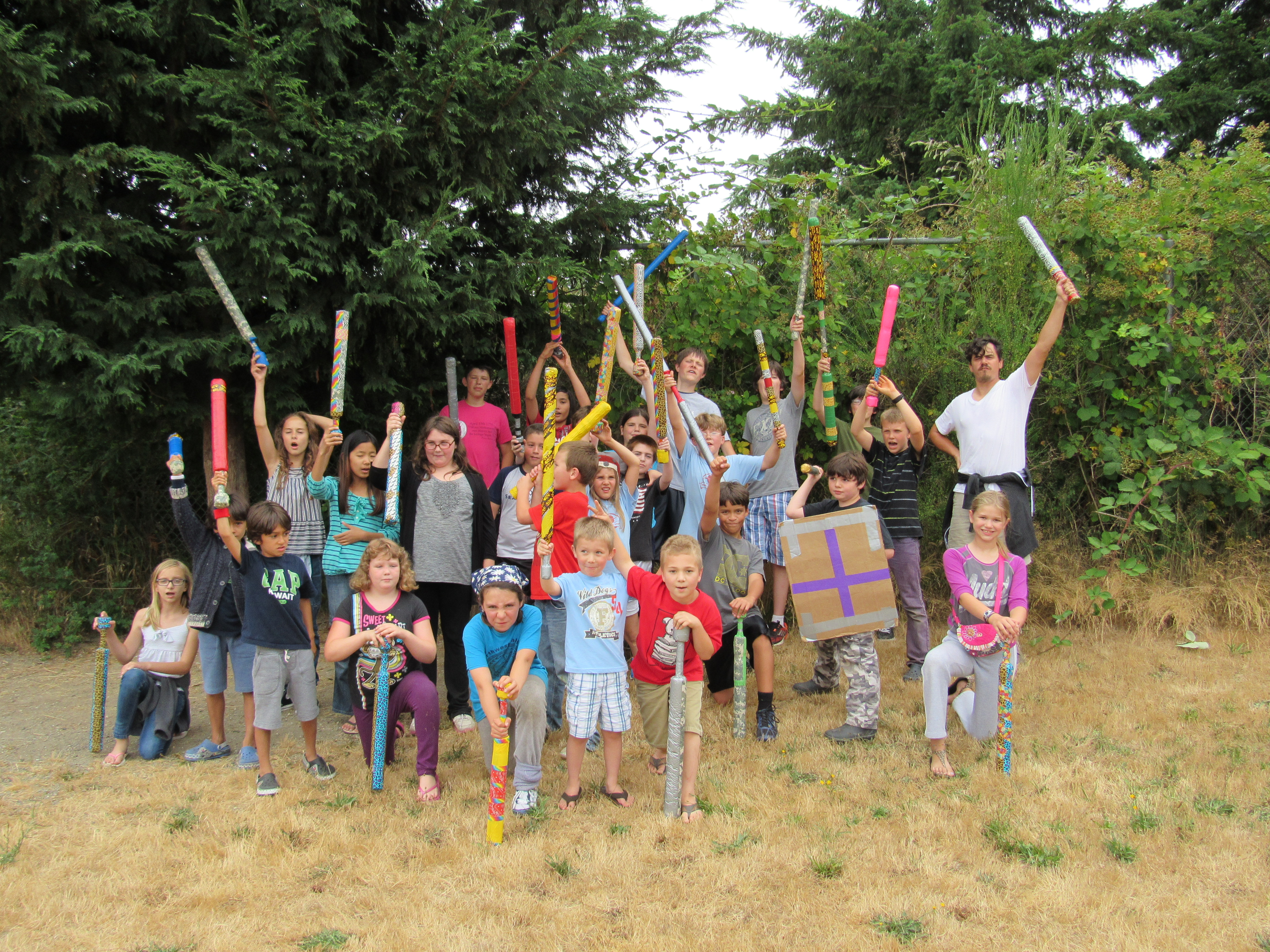 Large group of kids holding boffer swords