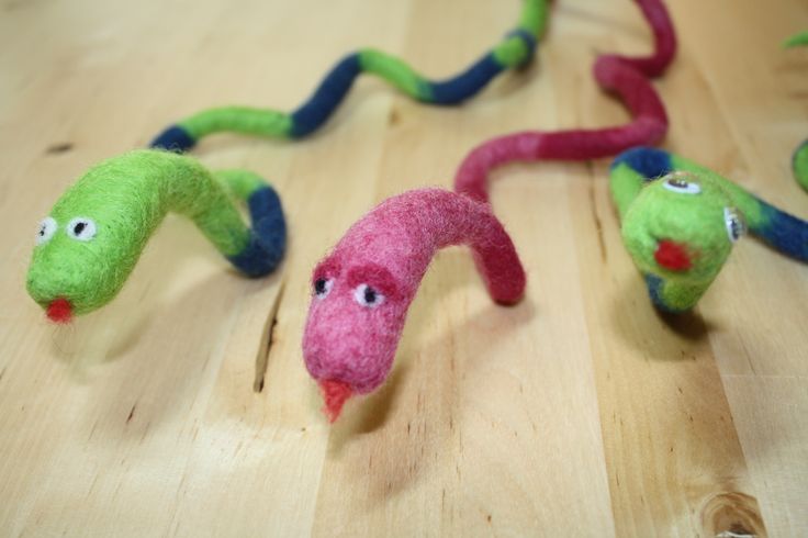 Wet-felted snakes in bright colors