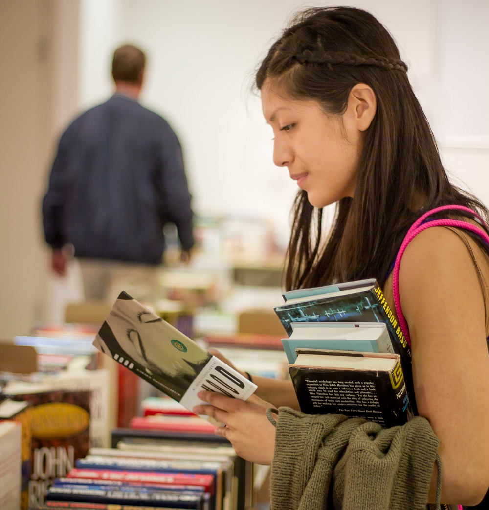 woman shopping at book sale
