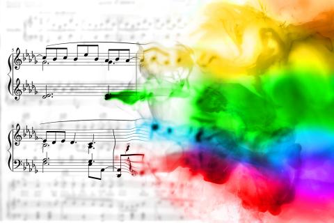 Image of musical notes blending in to watercolors.