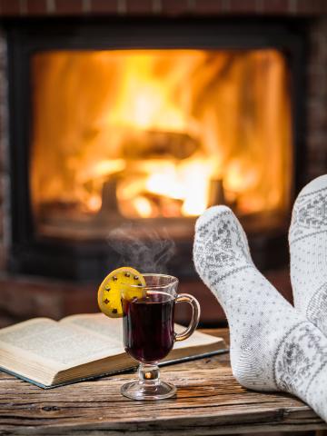 Socks, books, a warm beverage, and a crackling fire.