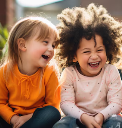 two preschoolers laughing