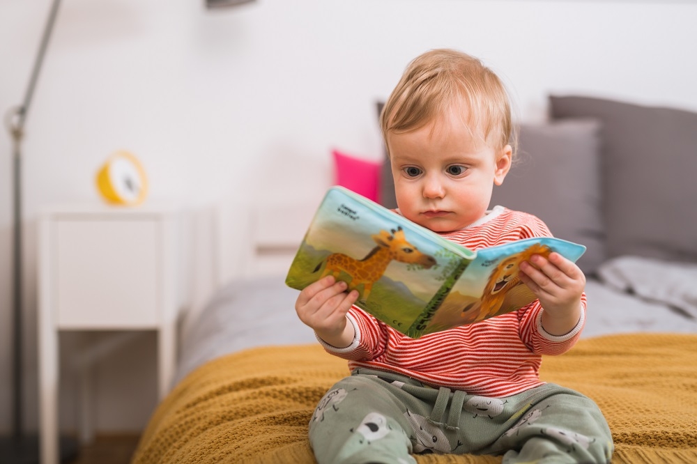 baby reading a book